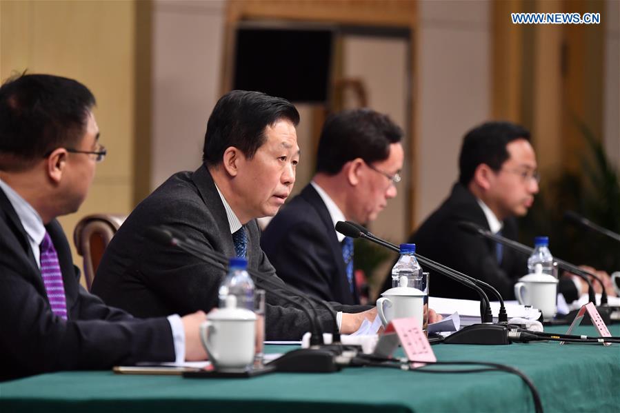 Chinese Minister of Finance Xiao Jie (2nd L) answers questions on reform of fiscal and taxation system and financial work at a press conference for the fifth session of the 12th National People's Congress in Beijing, capital of China, March 7, 2017. (Xinhua/Li Xin)