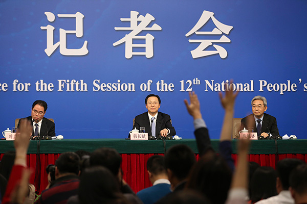 Minister of Agriculture Han Changfu (center) attends a news conference of the two sessions in Beijing, March 7, 2017. [Feng Yongbin/China Daily]