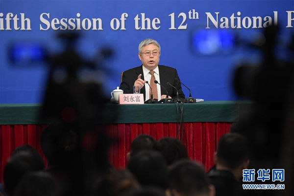 Liu Yongfu, director of the State Council Leading Group Office of Poverty Alleviation and Development, makes the comment on Tuesday during a news conference at the fifth session of the 12th National People's Congress. [Xinhua]