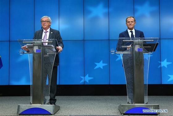 European Council President Donald Tusk (R) and European Commission President Jean-Claude Juncker attend a joint press conference after the European spring summit in Brussels, Belgium on march 10, 2017. [Photo/Xinhua] 