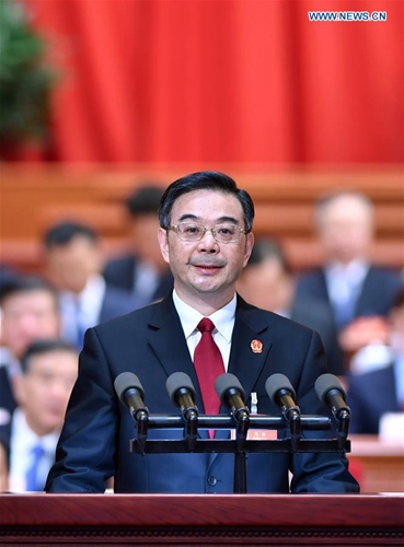 Chief Justice Zhou Qiang delivers a work report of the Supreme People's Court at the third plenary meeting of the fifth session of the 12th National People's Congress at the Great Hall of the People in Beijing, capital of China, March 12, 2017. [Photo/Xinhua]