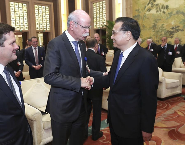 Chinese Premier Li Keqiang (R, front) shakes hands with Dieter Zetsche, chairman of Daimler AG and head of Mercedes-Benz Cars, when meeting with foreign representatives of the China Development Forum (CDF) 2017 in Beijing, capital of China, March 20, 2017. [Photo/Xinhua]