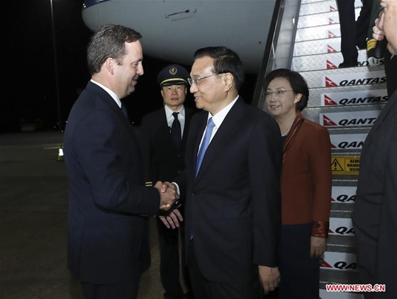 Chinese Premier Li Keqiang (3rd L) arrives with his wife Cheng Hong (4th L) in Canberra, Australia, March 22, 2017, for an official visit to Australia at the invitation of his Australian counterpart Malcolm Turnbull. [Photo/Xinhua]