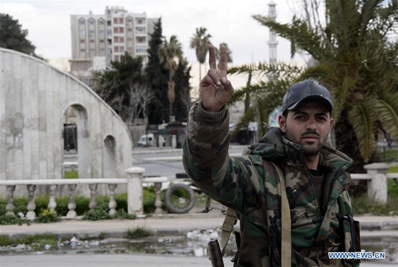 A Syrian soldier flashes the victory sign at the Abbasyieen area in the east of Damascus, capital of Syria, on March 20, 2017. [Photo/Xinhua] 