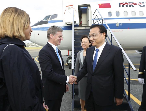 Chinese Premier Li Keqiang (1st R) arrives with his wife Cheng Hong (2nd R) in Wellington, New Zealand, March 26, 2017, for an official visit to New Zealand at the invitation of his New Zealand's counterpart Bill English. [Photo/Xinhua] 