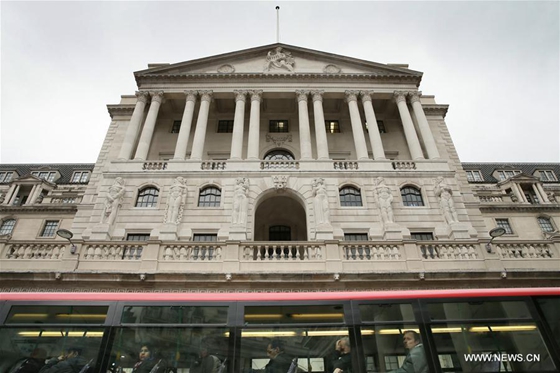 A bus drives past the Bank of England after the British government triggered Article 50 of the Lisbon Treaty, in London, Britain on March 29, 2017. [Photo/Xinhua]