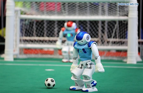 Robots take part in a soccer match during the 2017 RoboCup in Rizhao, east China's Shandong Province, April 2, 2017. [Photo/Xinhua]