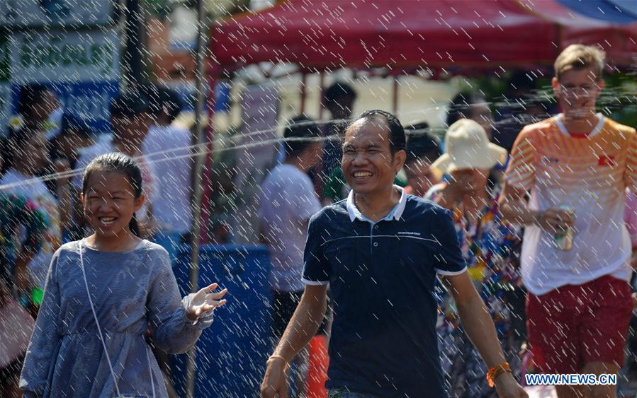 People celebrate Songkran festival in Vientiane, Laos