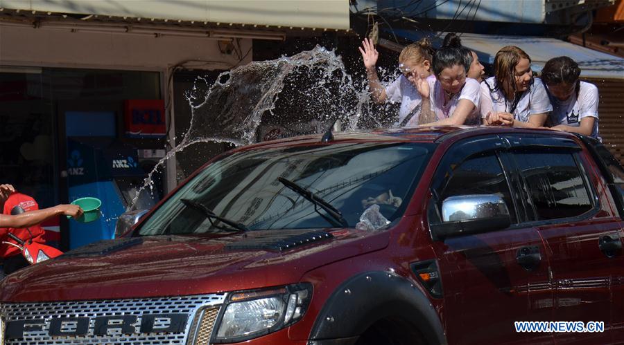 People celebrate Songkran festival in Vientiane, Laos