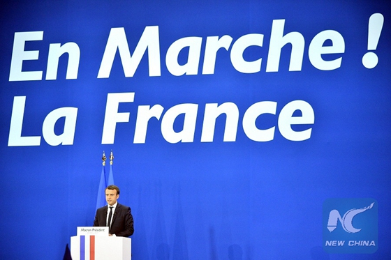 Emmanuel Macron, French presidential candidate for the On the Move (En Marche) movement, delivers a speech at a rally after the first round of French presidential election in Paris, France on April 23, 2017. [Photo/Xinhua] 