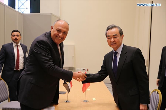 Chinese Foreign Minister Wang Yi (R, front) shakes hands with his Egyptian counterpart Sameh Shoukry (L, front) during their meeting on the sidelines of the Ancient Civilization Forum in Athens, Greece, on April 24, 2017. [Photo/Xinhua]