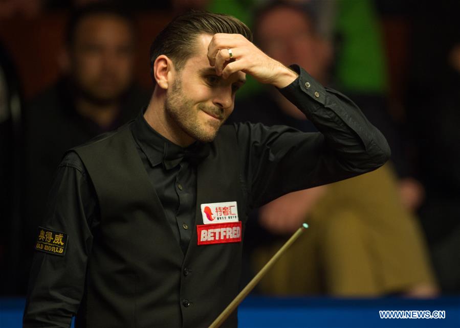 Mark Selby of England reacts during the third session of the semifinal against Ding Junhui of China during the World Snooker Championship 2017 at the Crucible Theatre in Sheffield, Britain on April 28, 2017. (Xinhua/Jon Buckle