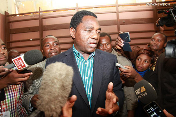 Hakainde Hichilema, opposition leader of the United Party for National Development (UPND), speaks to the media after casting his vote at a polling station at Kabulonga Boys Secondary School in Lusaka, capital of Zambia, Jan. 20, 2015. [File photo / Xinhua]