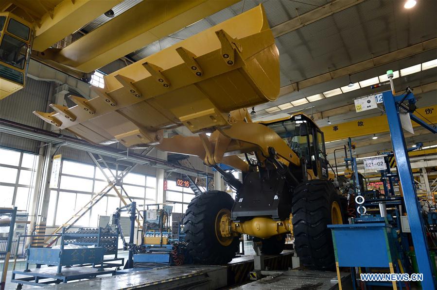 Photo taken on May 4, 2017 shows an excavator on the production line of Shandong Lingong Construction Machinery Co., Ltd. in Linyi, east China&apos;s Shandong Province. The enterprise have exported its construction machinery products to Malaysia, India, Russia, Saudi Arabia and some other countries and regions. (Xinhua/Guo Xuelei)