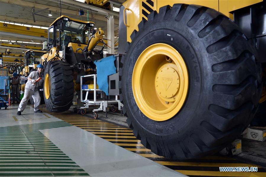 A worker is seen on the assembly line of loading machine in Shandong Lingong Construction Machinery Co., Ltd. in Linyi, east China&apos;s Shandong Province, May 4, 2017. The enterprise have exported its construction machinery products to Malaysia, India, Russia, Saudi Arabia and some other countries and regions. (Xinhua/Guo Xuelei)