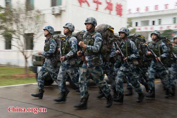 Soldiers and officers of a mobile radar force in the Southern Theater Command of the PLA (People&apos;s Liberation Army) assemble for an exercise. [Photo by Chen Boyuan / China.org.cn]