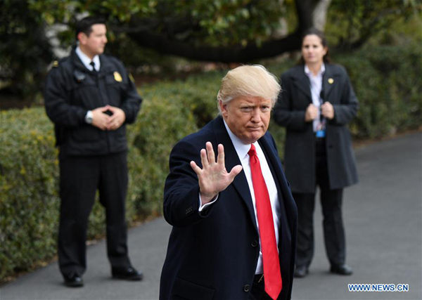 U.S. President Donald Trump (C) gestures to media before boarding Marine One departing for Andrews Air Force Base en route to West Palm Beach, Florida, at White House in Washington D.C.,the United States, Feb. 3, 2017. (File photo / Xinhua)