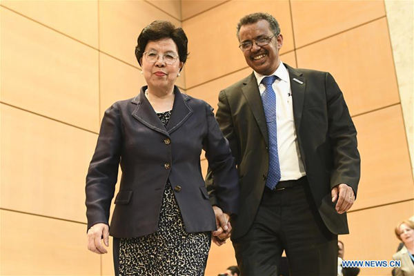 Newly elected Director-General of World Health Organization (WHO) Tedros Adhanom (R) walks next to WHO's outgoing chief Margaret Chan during the 70th World Health Assembly in Geneva, Switzerland, May 23, 2017. (Xinhua/Alain Grosclaude)