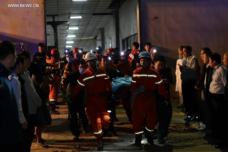 Rescuers work at the scene of the flooded coal mine in Qingxu County, north China's Shanxi Province, May 23, 2017. Four of 11 trapped miners have been rescued following a coal mine flood late Monday night in Shanxi Province, according to the rescue headquarters late Tuesday. Rescuers are still searching for the other seven trapped miners. (Xinhua/Cao Yang) 