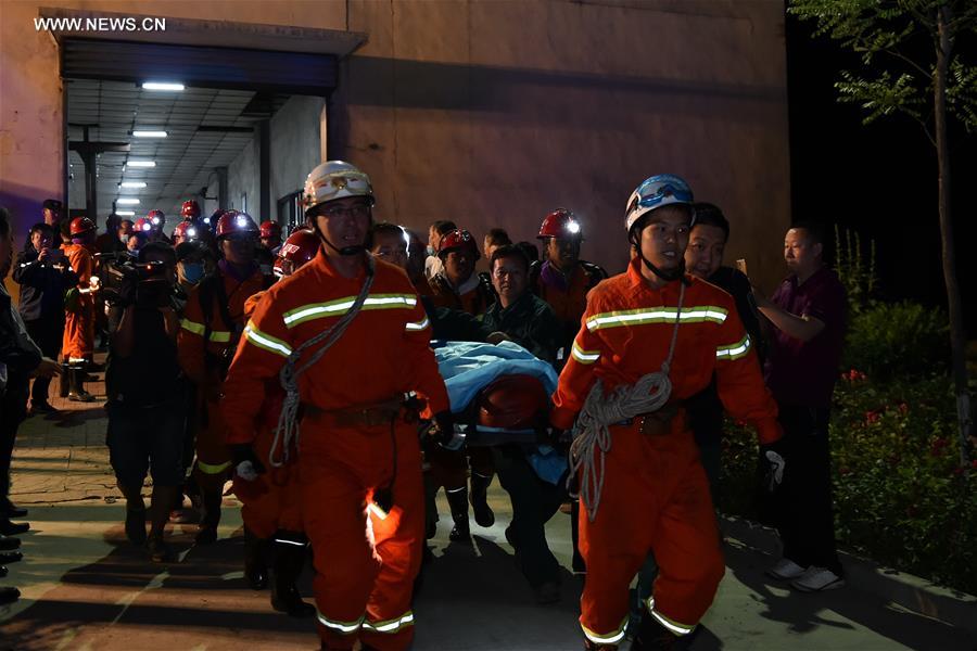 Rescuers work at the scene of the flooded coal mine in Qingxu County, north China&apos;s Shanxi Province, May 23, 2017. Four of 11 trapped miners have been rescued following a coal mine flood late Monday night in Shanxi Province, according to the rescue headquarters late Tuesday. Rescuers are still searching for the other seven trapped miners. (Xinhua/Cao Yang) 
