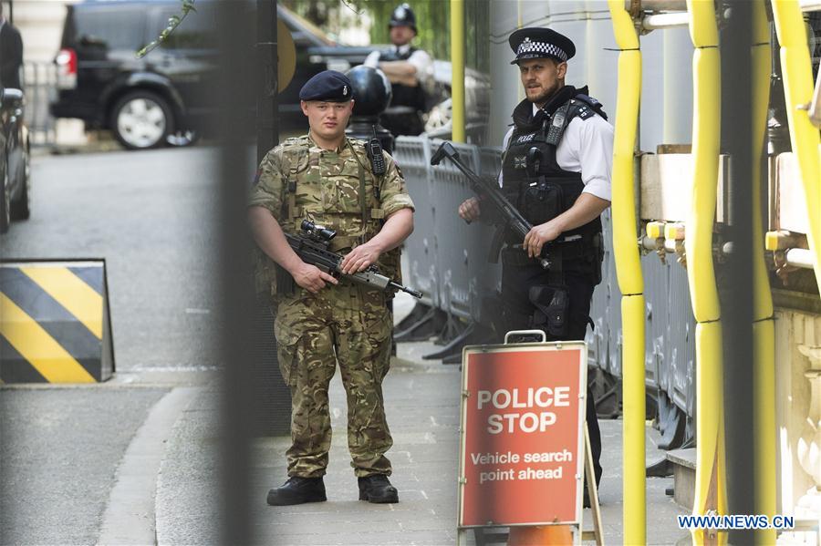 An armed soldier stands guard at 10 Downing Street in London, Britain, on May 24, 2017. British Prime Minister Theresa May announced Tuesday night that the country&apos;s terror threat level has been raised from &apos;severe&apos; to &apos;critical&apos;, its highest level. (Xinhua/Ray Tang)