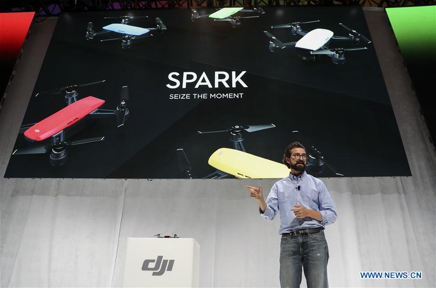 Michael Perry, director of strategic partnerships of DJI, introduces the palm-sized drone &apos;Spark&apos; during an event in New York, the United States, on May 24, 2017. DJI announced its first palm-sized drone &apos;Spark&apos; here on Wednesday. (Xinhua/Wang Ying)