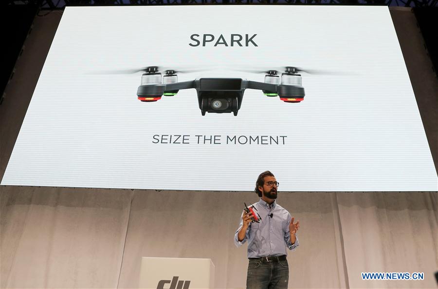 Michael Perry, director of strategic partnerships of DJI, introduces the palm-sized drone &apos;Spark&apos; during an event in New York, the United States, on May 24, 2017. DJI announced its first palm-sized drone &apos;Spark&apos; here on Wednesday. (Xinhua/Wang Ying) 