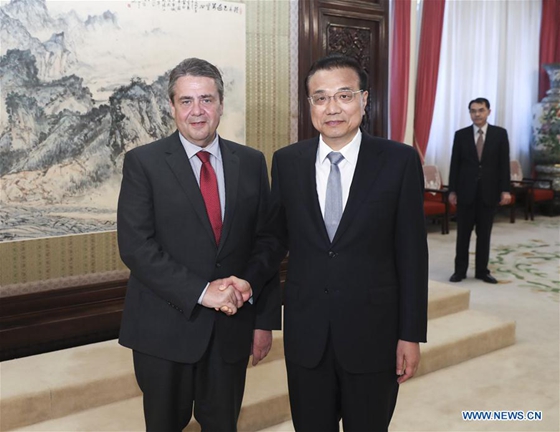 Chinese Premier Li Keqiang (R) meets with German Vice Chancellor and Foreign Minister Sigmar Gabriel, who is in Beijing to attend the first meeting of the China-Germany people-to-people exchange dialogue, in Beijing, capital of China, May 24, 2017. [Photo/Xinhua] 