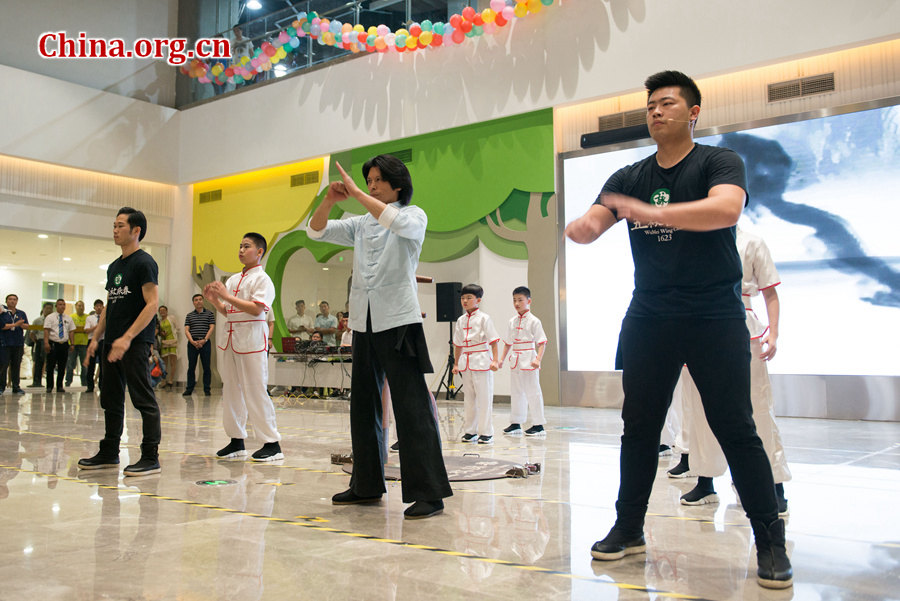 Children and their teachers perform Wing Chun kungfu during a grand celebration held at the newly established China Soong Ching Ling Science and Culture Center for Young People in Beijing on May 31, one day ahead of International Children&apos;s Day. The celebration, themed &apos;Dream of the Future Belt and Road Young Hearts,&apos; was organized by China Soong Ching Ling Foundation (CSCLF) in a bid to promote communication between young people from countries along the Belt and Road. [Photo by Chen Boyuan / China.org.cn]
