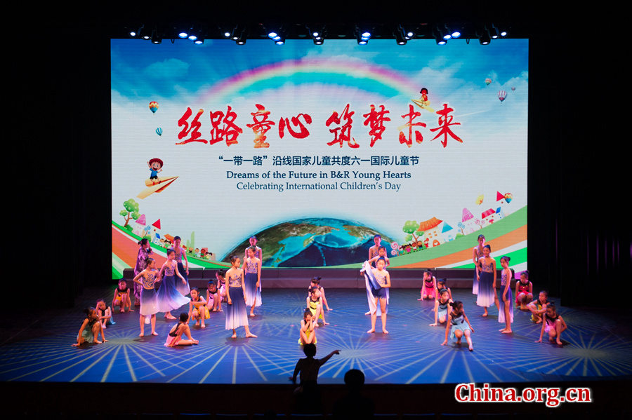 Primary school children perform dance 'I make friends with the sea' during a grand celebration held at the newly established China Soong Ching Ling Science and Culture Center for Young People in Beijing on May 31, one day ahead of International Children's Day. [Photo by Chen Boyuan / China.org.cn]