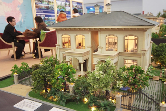 A villa project of China Evergrande Group on display at a housing fair in Beijing. [Photo/China Daily]