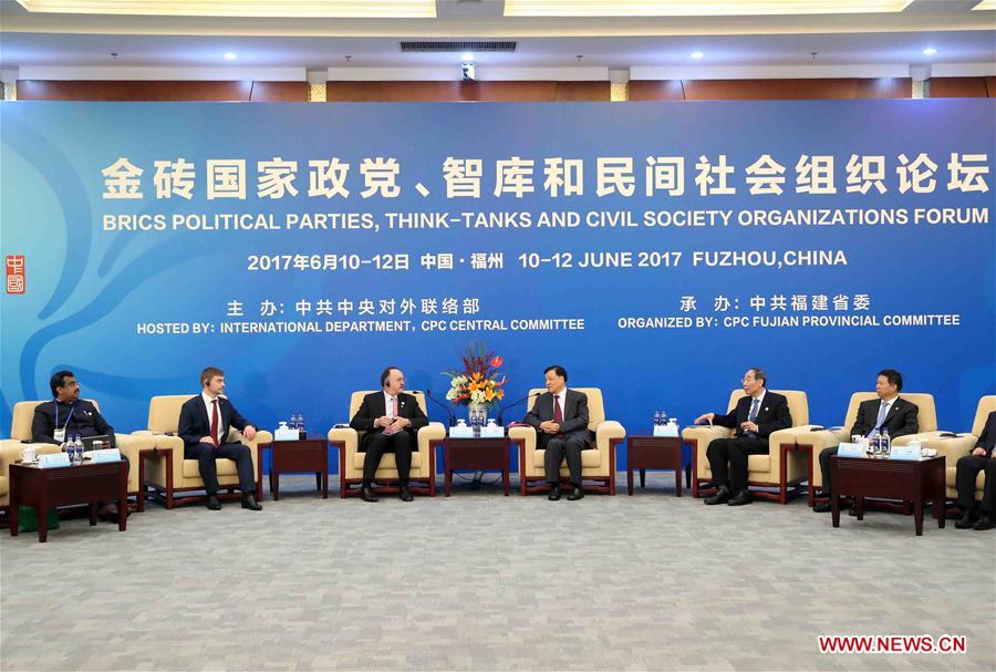 Liu Yunshan, a member of the Standing Committee of the Political Bureau of the Communist Party of China (CPC) Central Committee, meets with foreign representatives before the opening ceremony of the BRICS Political Parties, Think-tanks and Civil Society Organizations Forum in Fuzhou, capital of southeast China's Fujian Province, June 11, 2017. [Photo/Xinhua]