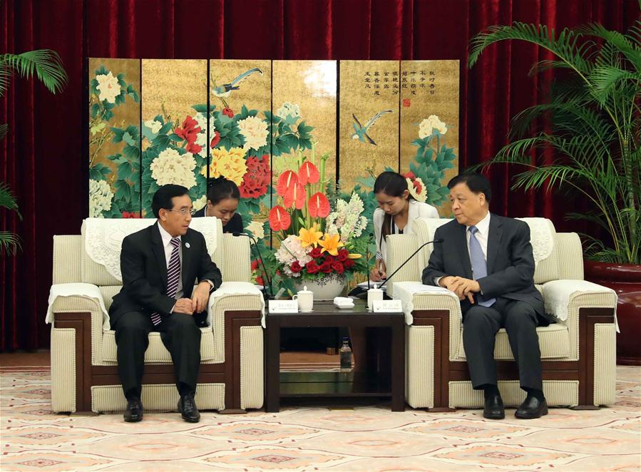 Liu Yunshan (R), a member of the Standing Committee of the Political Bureau of the Communist Party of China (CPC) Central Committee, meets with Phankham Viphavanh, a member of the Political Bureau of the Lao People's Revolutionary Party (PRP) Central Committee and vice president of Laos, in Fuzhou, capital of southeast China's Fujian Province, June 11, 2017. [Photo/Xinhua]