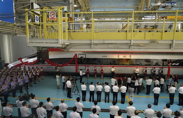 People attend a naming ceremony for the new models of China's electric multiple unit (EMU) train 'Fuxing' in Beijing, capital of China, June 25, 2017. China holds complete intellectual property rights of 'Fuxing' high speed trains. Two new 'Fuxing' trains will debut on Beijing-Shanghai high speed railway line on June 26, 2017 in Beijing and Shanghai at the same time. [Photo/Xinhua]