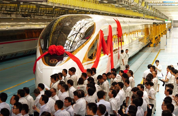 People attend a naming ceremony for the new models of China's electric multiple unit (EMU) train 'Fuxing' in Beijing, capital of China, June 25, 2017. China holds complete intellectual property rights of 'Fuxing' high speed trains. Two new 'Fuxing' trains will debut on Beijing-Shanghai high speed railway line on June 26, 2017 in Beijing and Shanghai at the same time. [Photo/Xinhua]