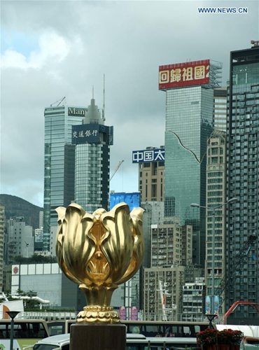 Photo taken on June 27, 2017 shows the Golden Bauhinia statue in Hong Kong, south China. July 1, 2017 marks the 20th anniversary of Hong Kong's return to the motherland. [Photo/Xinhua]