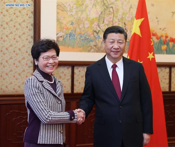 Chinese President Xi Jinping (R) meets with Lam Cheng Yuet-ngor, the newly appointed chief executive of the Hong Kong Special Administrative Region (HKSAR), in Beijing, capital of China, April 11, 2017. [File photo/Xinhua]