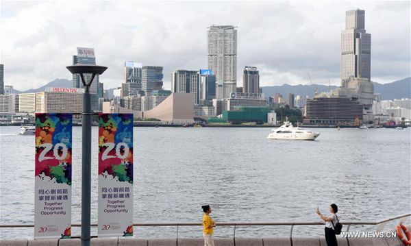 Photo taken on June 27, 2017 shows celebration posters near Tamar Park in Hong Kong, south China. July 1, 2017 marks the 20th anniversary of Hong Kong's return to the motherland. [Photo/Xinhua]
