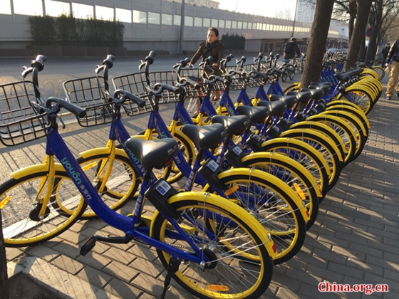 Shared bikes are seen on a street in the Haidian District, Beijing, on February 27, 2017. [Photo by Li Jingrong/China.org.cn 