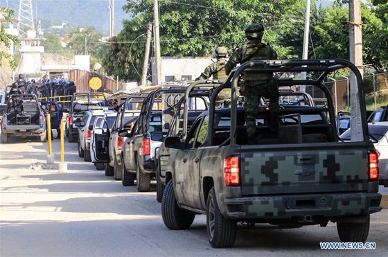 Police officers arrive at a prison after a clash among inmates in Acapulco, Mexico, on July 6, 2017. [Photo/Xinhua]