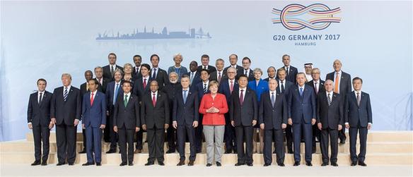 Chinese President Xi Jinping and other leaders attending the 12th Summit of the Group of 20 (G20) major economies pose for a group photo in Hamburg, Germany, July 7, 2017. [Photo/Xinhua]