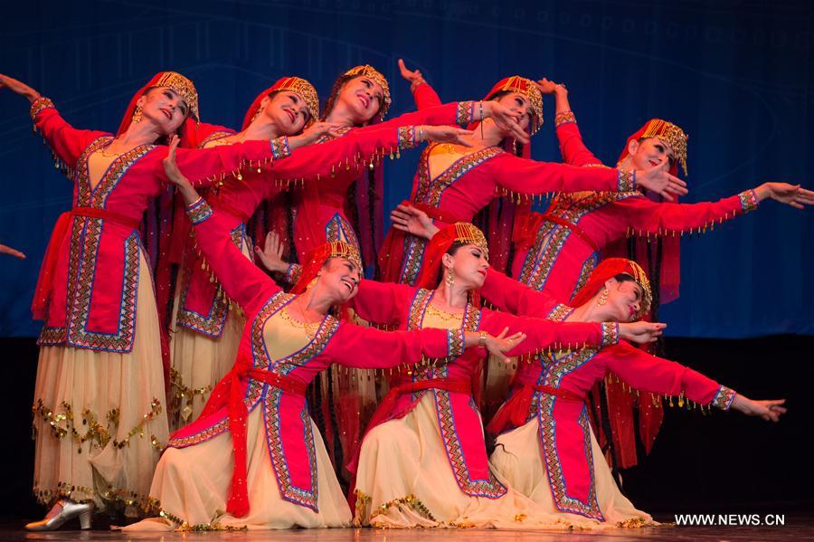 Artists from China's Xinjiang Uygur Autonomous Region dance in Alexandria, Egypt, on July 10, 2017. Xinjiang Uygur Autonomous Region, which represents China as the guest of honor of the 15th International Summer Festival held from July 10 to August 26 in Egypt's seaside historical city of Alexandria, gave an enchanting performance on Monday. [Photo/Xinhua]