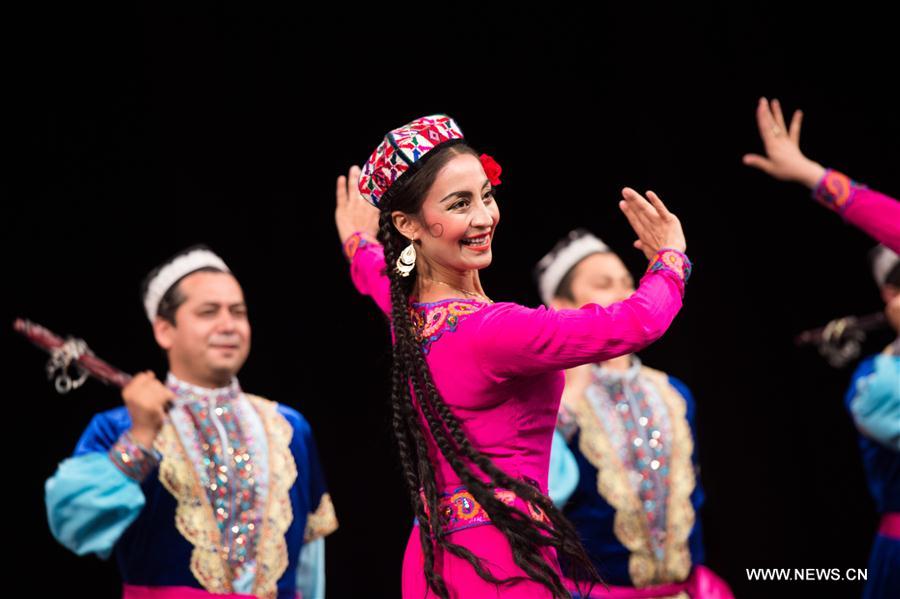 Artists from China's Xinjiang Uygur Autonomous Region dance in Alexandria, Egypt, on July 10, 2017. Xinjiang Uygur Autonomous Region, which represents China as the guest of honor of the 15th International Summer Festival held from July 10 to August 26 in Egypt's seaside historical city of Alexandria, gave an enchanting performance on Monday. [Photo/Xinhua]