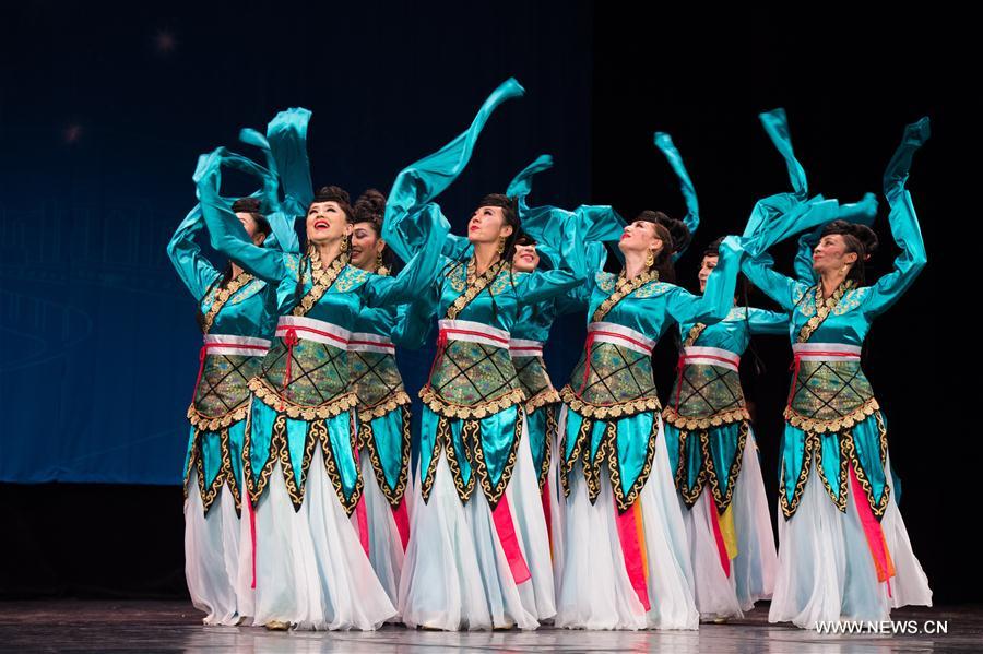 Artists from China's Xinjiang Uygur Autonomous Region dance in Alexandria, Egypt, on July 10, 2017. Xinjiang Uygur Autonomous Region, which represents China as the guest of honor of the 15th International Summer Festival held from July 10 to August 26 in Egypt's seaside historical city of Alexandria, gave an enchanting performance on Monday. [Photo/Xinhua]