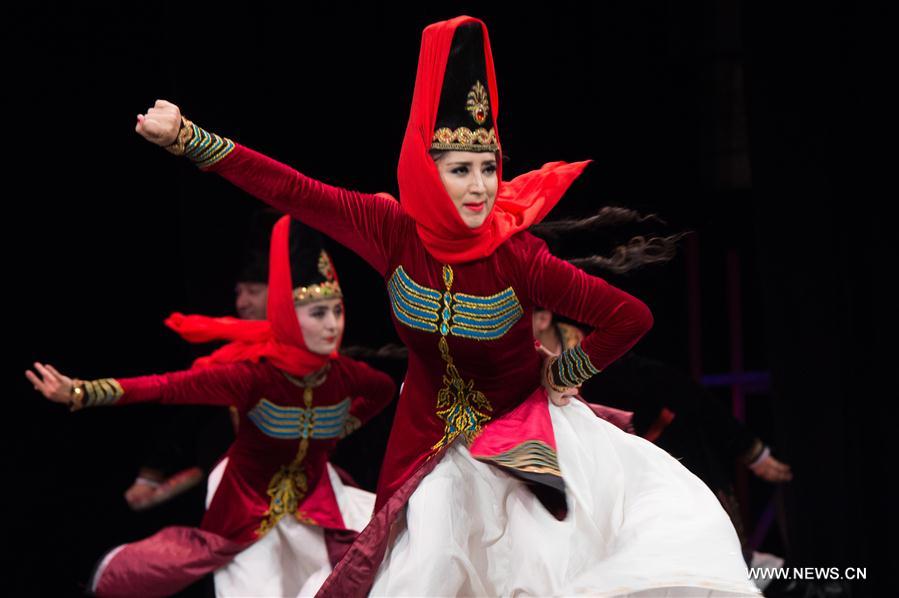 Artists from China's Xinjiang Uygur Autonomous Region dance in Alexandria, Egypt, on July 10, 2017. Xinjiang Uygur Autonomous Region, which represents China as the guest of honor of the 15th International Summer Festival held from July 10 to August 26 in Egypt's seaside historical city of Alexandria, gave an enchanting performance on Monday. [Photo/Xinhua]