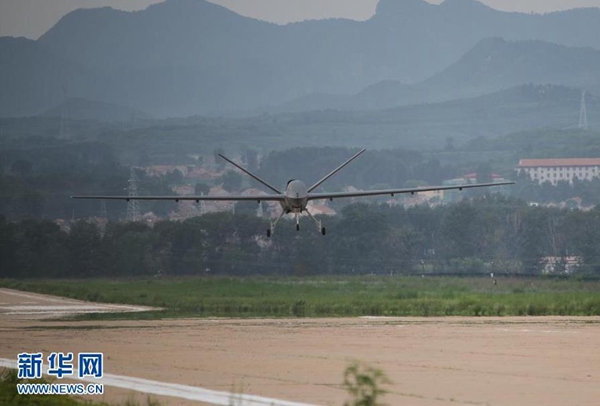 China's unmanned aerial vehicle CH-5, or 'Rainbow 5', completes its trial flight in north China's Hebei Province Friday. [Photo/Xinhua] 