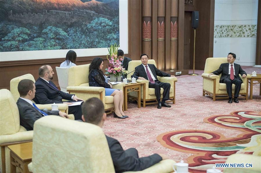 Liu Qibao (2nd R), head of the Publicity Department of the Central Committee of the Communist Party of China, meets with a group of government spokespersons from Central and Eastern European (CEE) countries in Beijing, capital of China, July 18, 2017. [Photo/Xinhua]