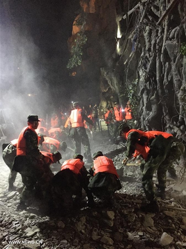 Rescuers work at a quake-hit tourist site in Zhangzha town, Jiuzhaigou County, southwest China's Sichuan Province, Aug. 9, 2017. [Photo/Xinhua]