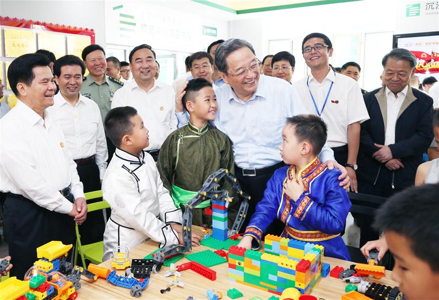 China's top political advisor Yu Zhengsheng visits a community of residents from various ethnic groups in Hohhot, north China's Inner Mongolia autonomous region, Aug 9, 2017. Yu led a delegation from the central authorities to celebrate the 70th anniversary of the founding of Inner Mongolia autonomous region.[Photo/Xinhua]