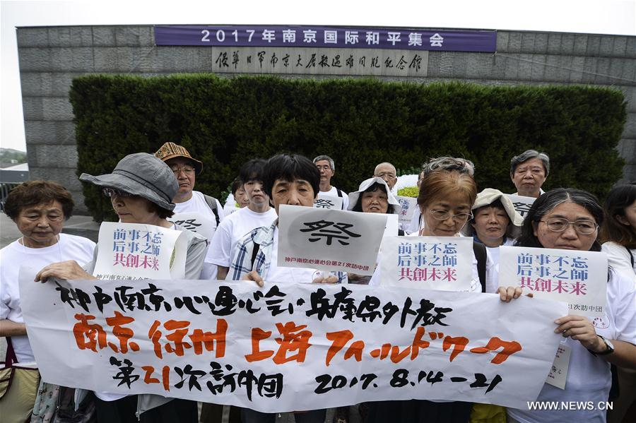 Members of an anti-war NGO based in Kobe, Japan attend a peace assembly at the Memorial Hall of the Victims in Nanjing Massacre by Japanese Invaders in Nanjing, capital of east China's Jiangsu Province, Aug. 15, 2017. [Photo: Xinhua/Ji Chunpeng]